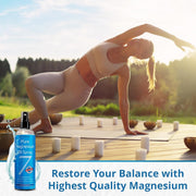 USP Grade Magnesium Oil spray bottle, 12 oz, with a woman practicing yoga outdoors on a wooden deck.