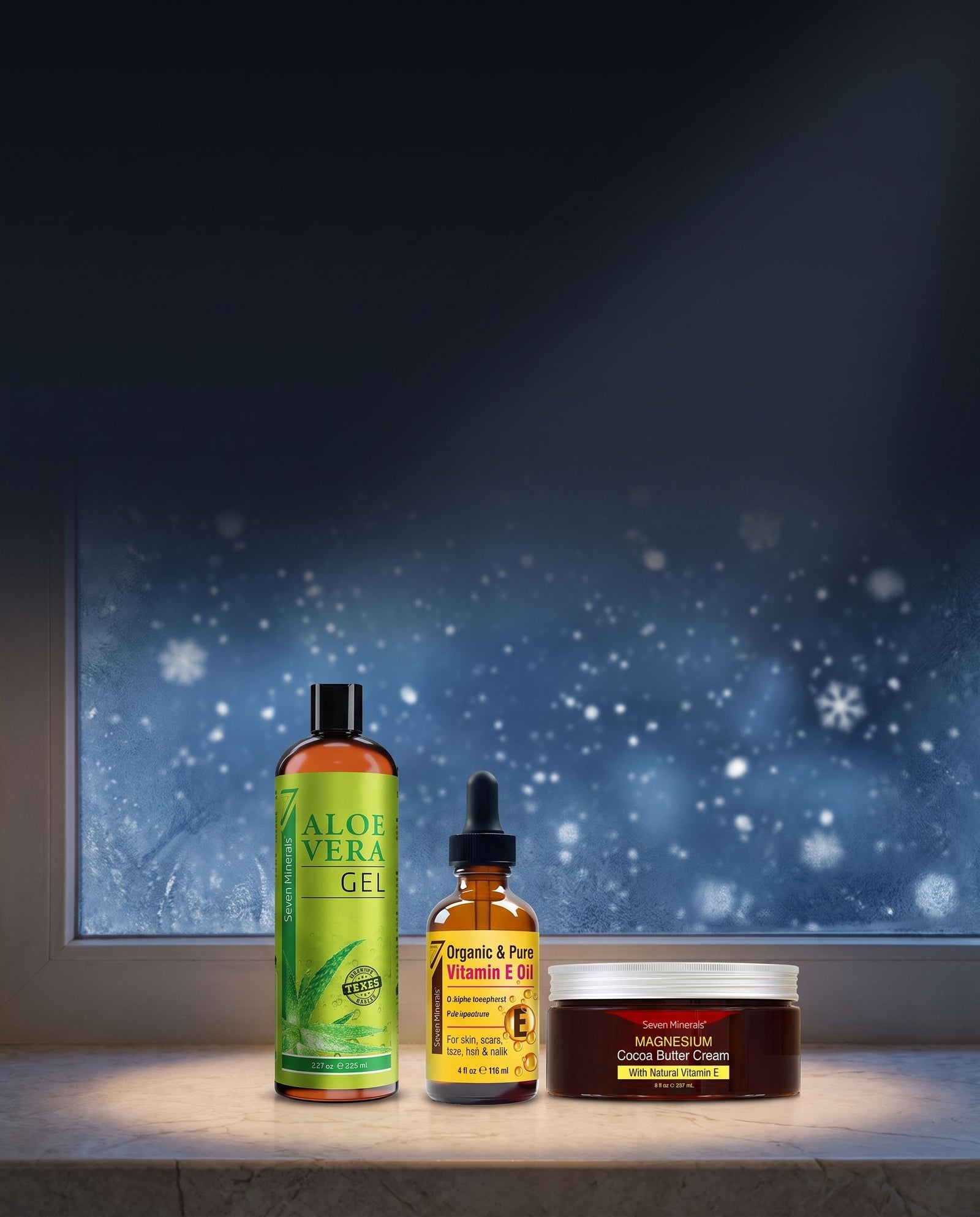 Seven Minerals Aloe Vera Gel, Vitamin E Oil and Magnesium Cocoa Butter Cream on a snowy windowsill